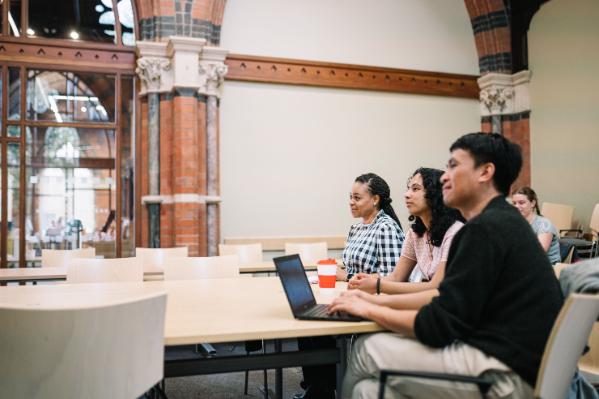 Students asking questions at a tutorial.