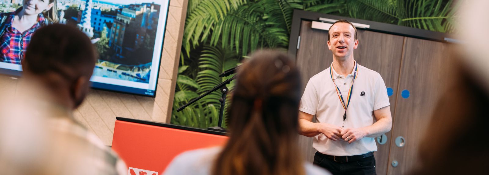 staff member giving a talk to a room full of students