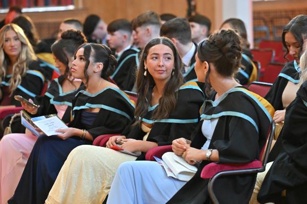 04. Graduates enjoy the uplifting ceremony, surrounded by peers, family and supporters.
