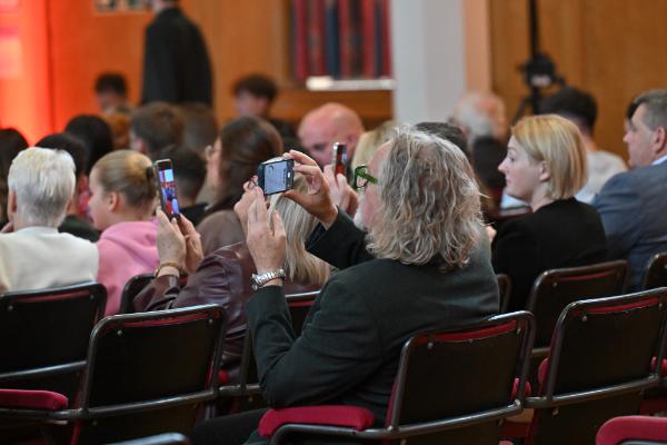 06. Community guests look on with pride as the graduates take to the stage to celebrate their achievements.
