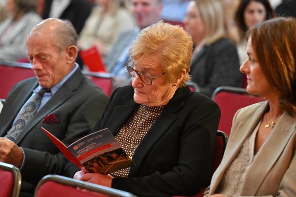 07. Guests follow along in the official graduation ceremony booklet.