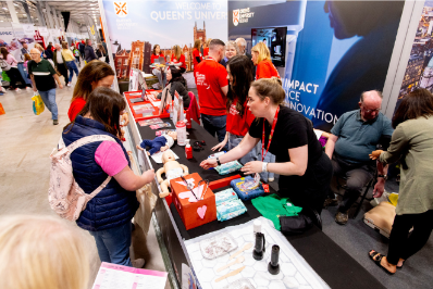 A member of faculty from the School of Nursing and Midwifery engages with an attendee at the Balmoral Show 2024