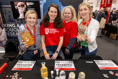 Four members of staff from Parasitology are pictured with various samples and specimens at the Balmoral Show 2024
