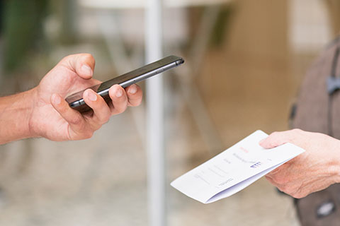 Someone scanning a letter with a phone