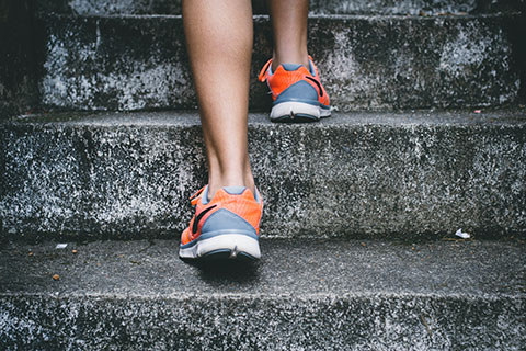 Feet in trainers on steps