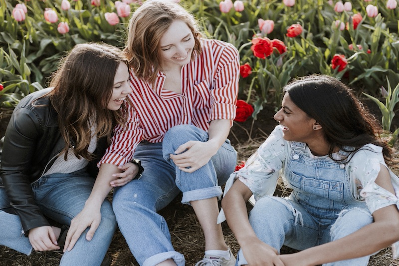 Young people in flower field