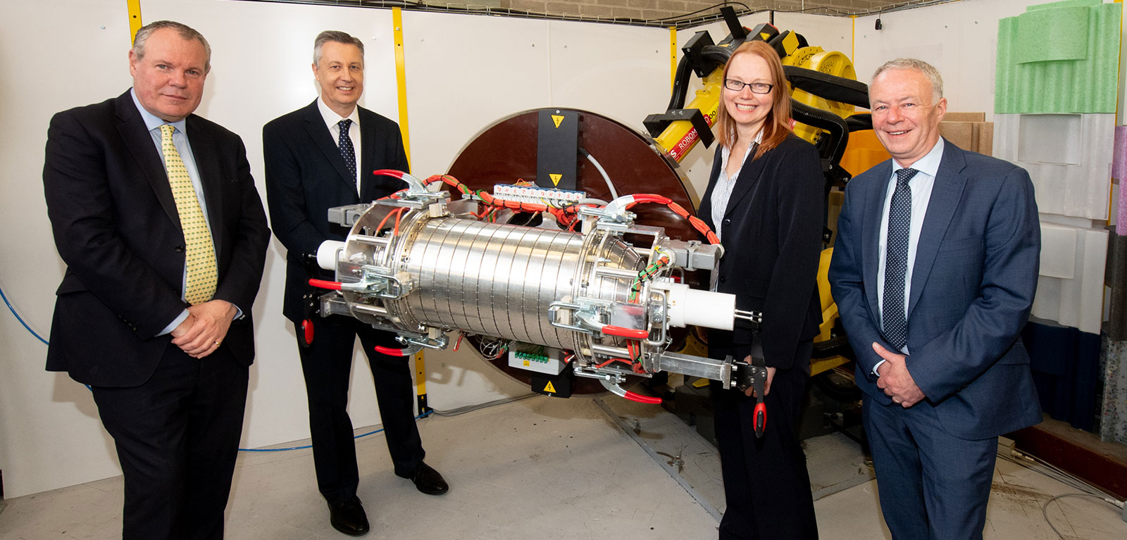 People surrounding an engine