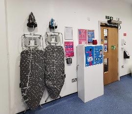 Ironing boards in the laundry room