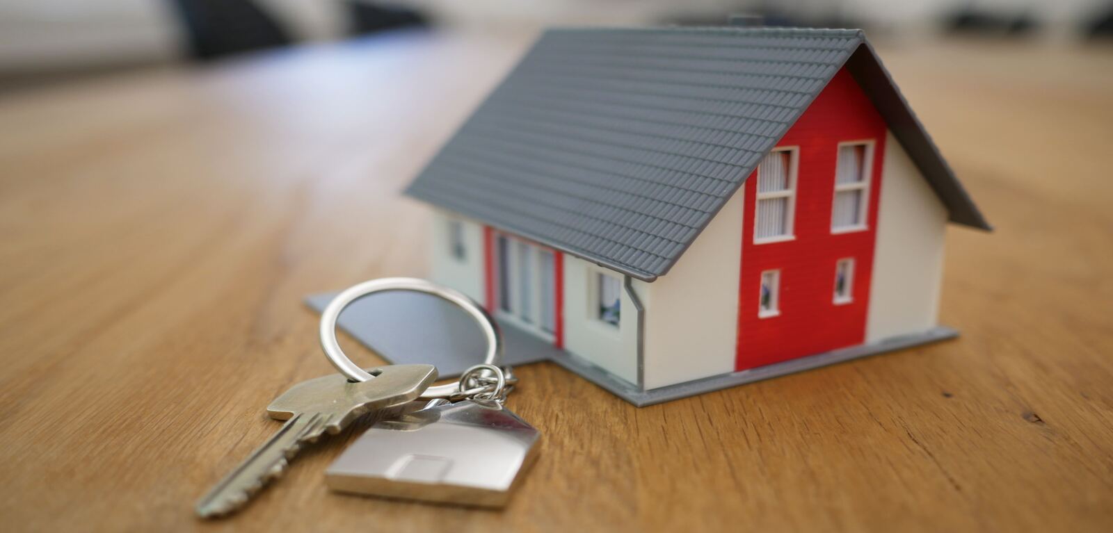 Small house on table with key