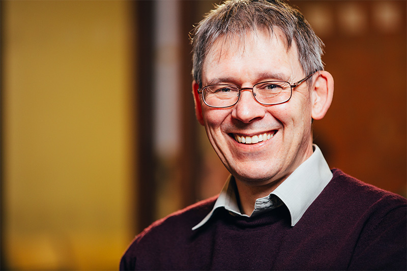 portrait photo of male academic in graduate school