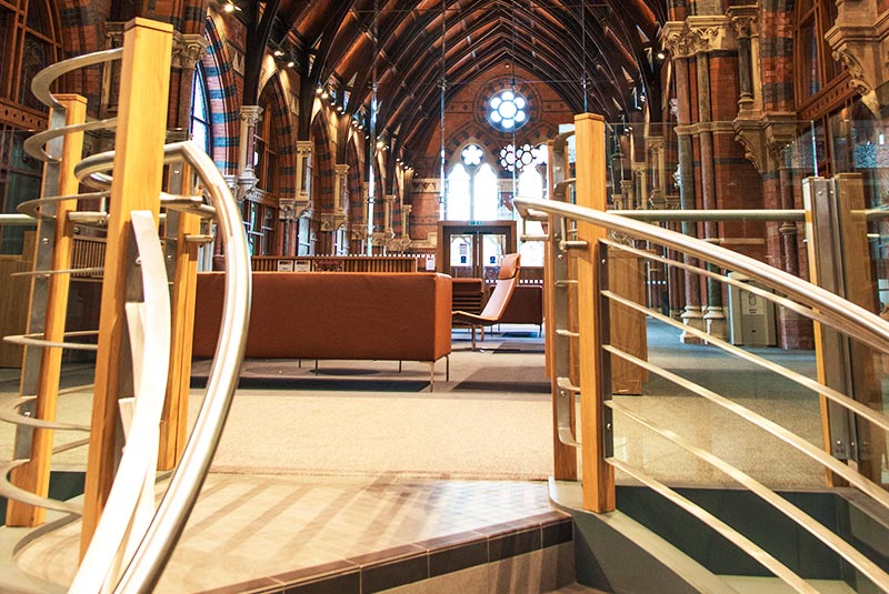 top of the spiral staircase in the graduate school and the first floor in the background