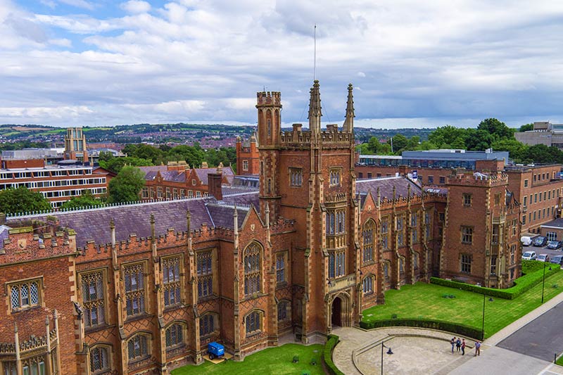 angled view of the front of the Lanyon building with views of Belfast in the background