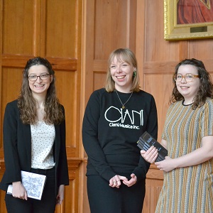 Staff from the Seamus Heaney Centre holding books