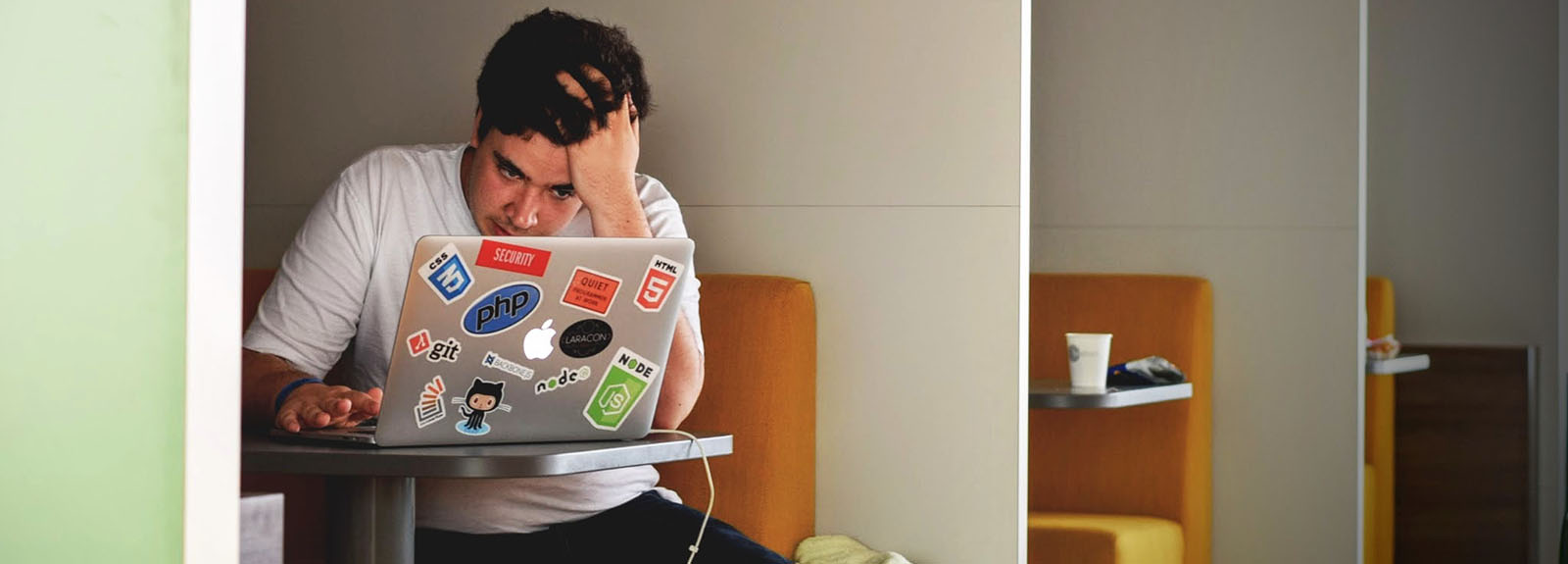 Boy on laptop looking stressed