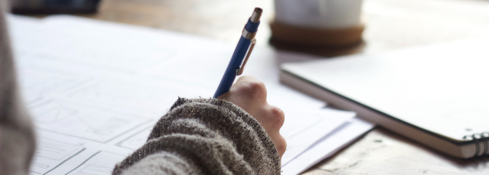 Hand with a pen writing