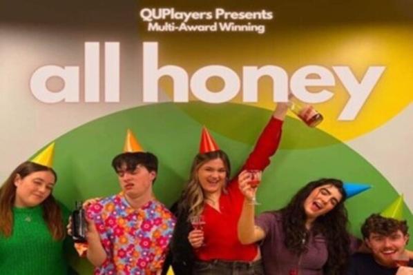 Students from QUPlayers in front of All Honey play poster