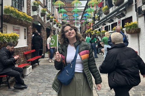 Student Allison in front of the umbrella light display in Commercial Court Belfast