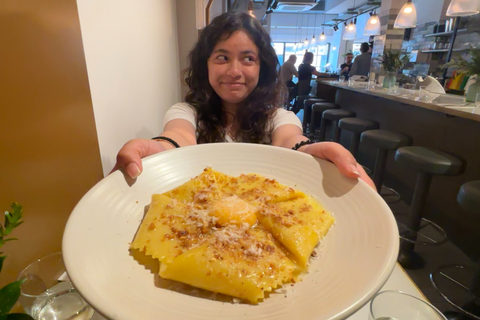 Student Christstela holding a plate of pasta