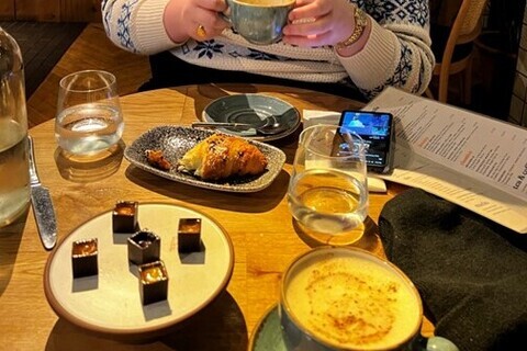 Chocolates and coffee on table in Crafty Vintner