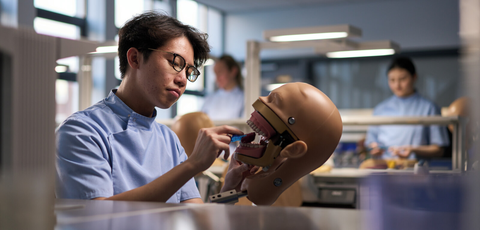 QUB dentistry student practising on phantom head