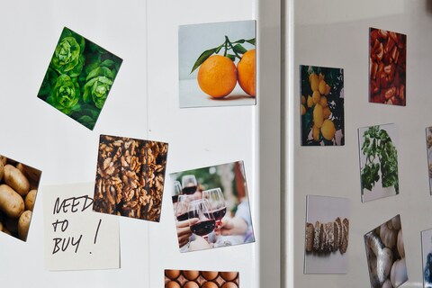 Images of fruit on magnets on fridge