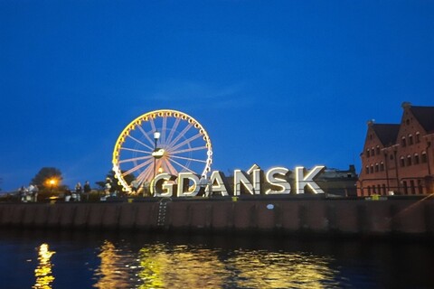 Gdansk sign with ferris wheel in background