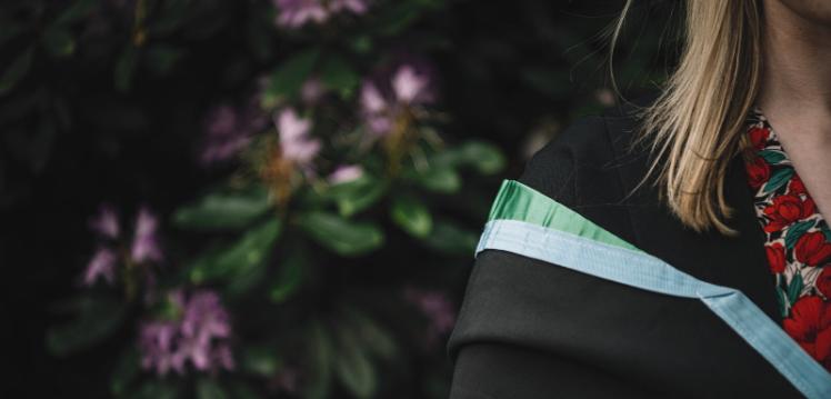 Student wearing Queen's graduation robe