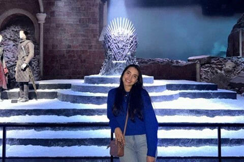 Student in the Iron Throne room in the Game of Thrones studio tour