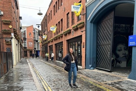 Student Isa standing in a street in Cathedral Quarter Belfast