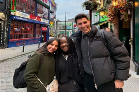 Student Isa with two friends outside a bar in Dublin