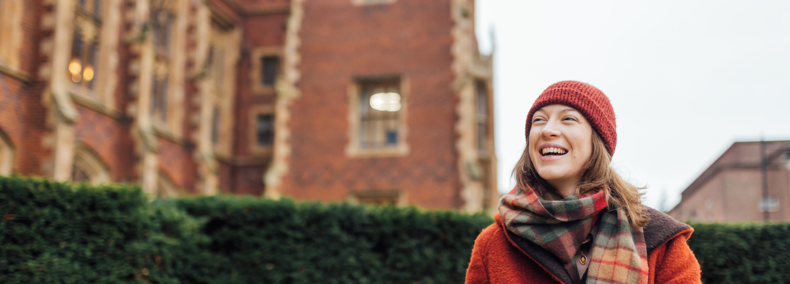 Student Lana sitting on the steps outside the Lanyon