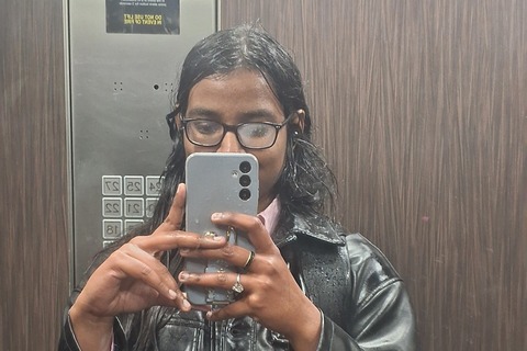 Student Natasha takes selfie inside lift