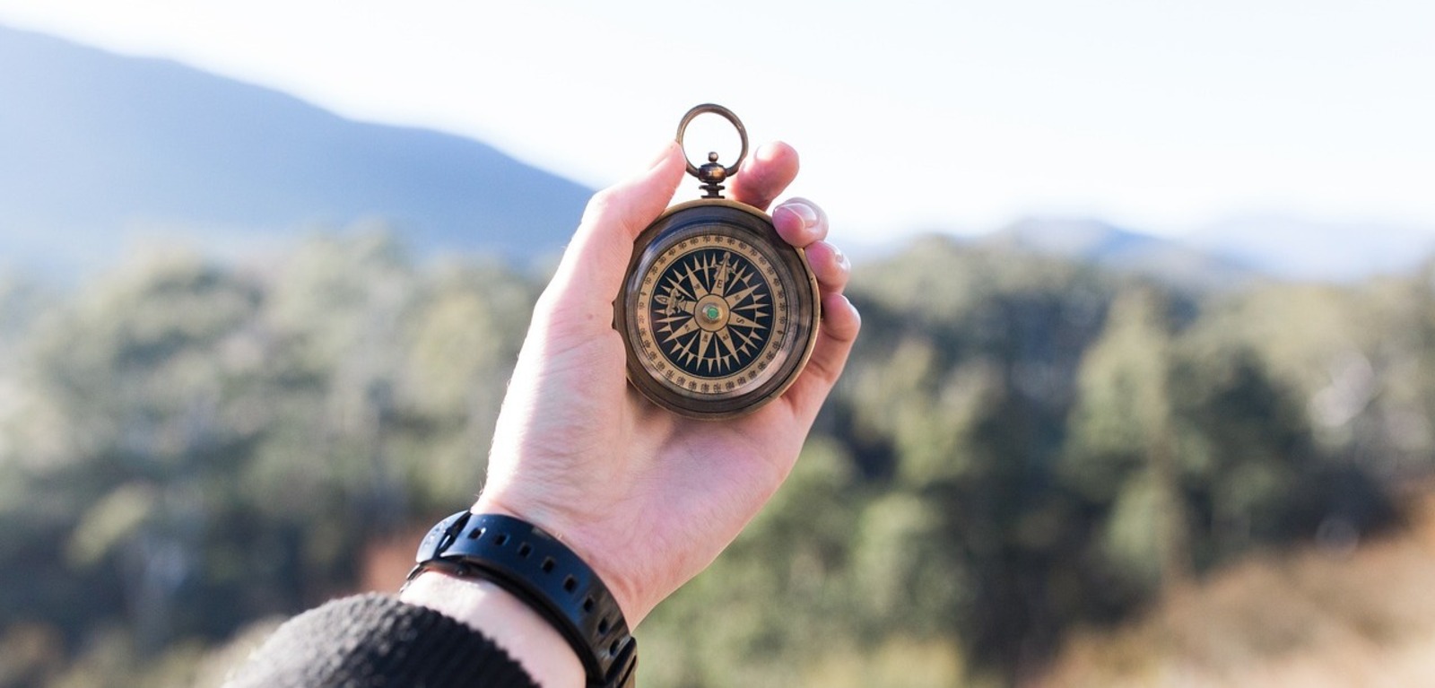 Person holding compass