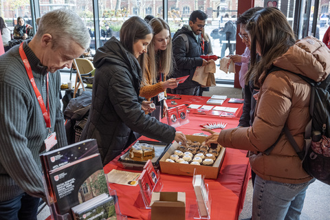 Staff and students at stall promoting PG Study in One Elmwood