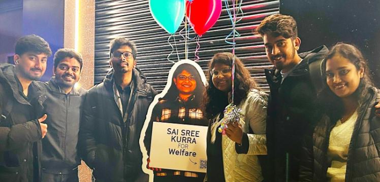 Sai Sree with friends and cardboard cut out of Sai