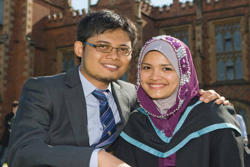 two young people, male and female, from an Asian ethnic background