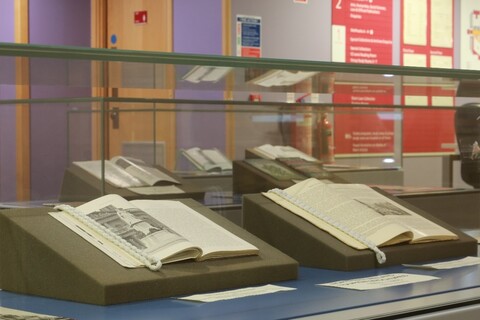 Glass display of books in the McClay