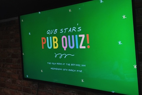 Poster on screen for QUB STAR pub quiz