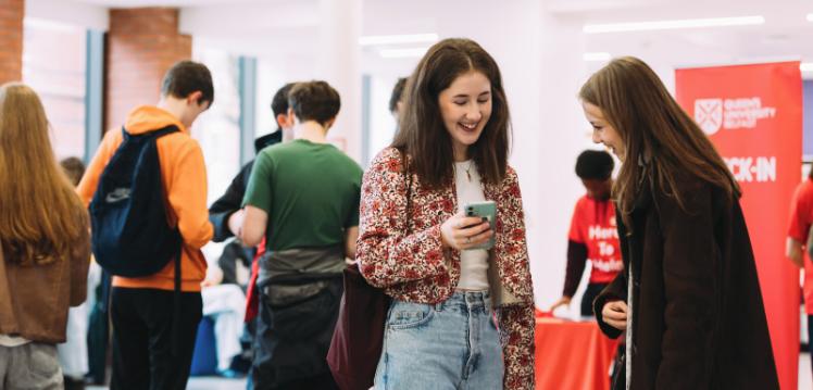Two students talking to each other on offer holder day