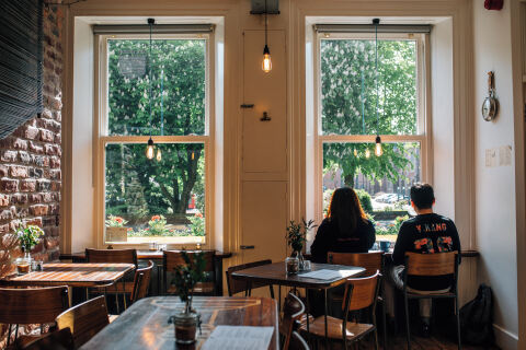 Two students in coffee shop