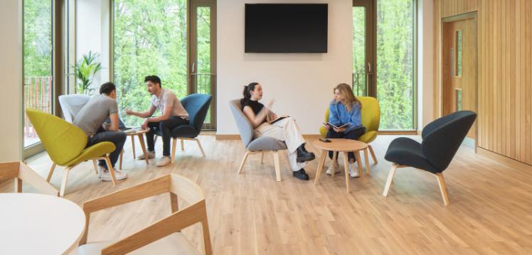 Students in seating area inside Riddel Hall