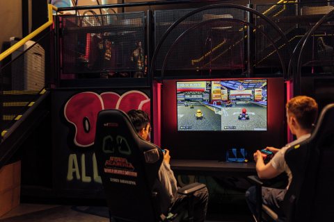 Students playing Mario Kart in Reboot Cafe