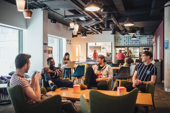 Students socialising in the common lounge in Elms BT1