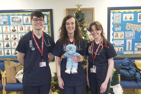 Three students from the Teddy Bear Hospital Society