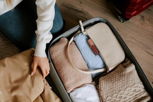 Woman packing suitcase