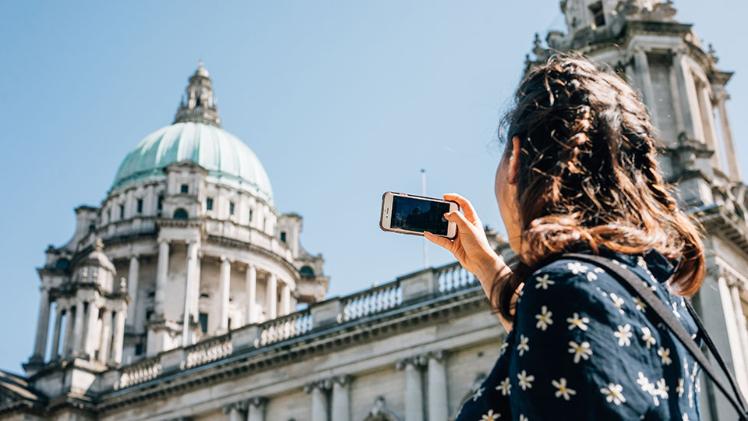 Student takes a photo of city hall