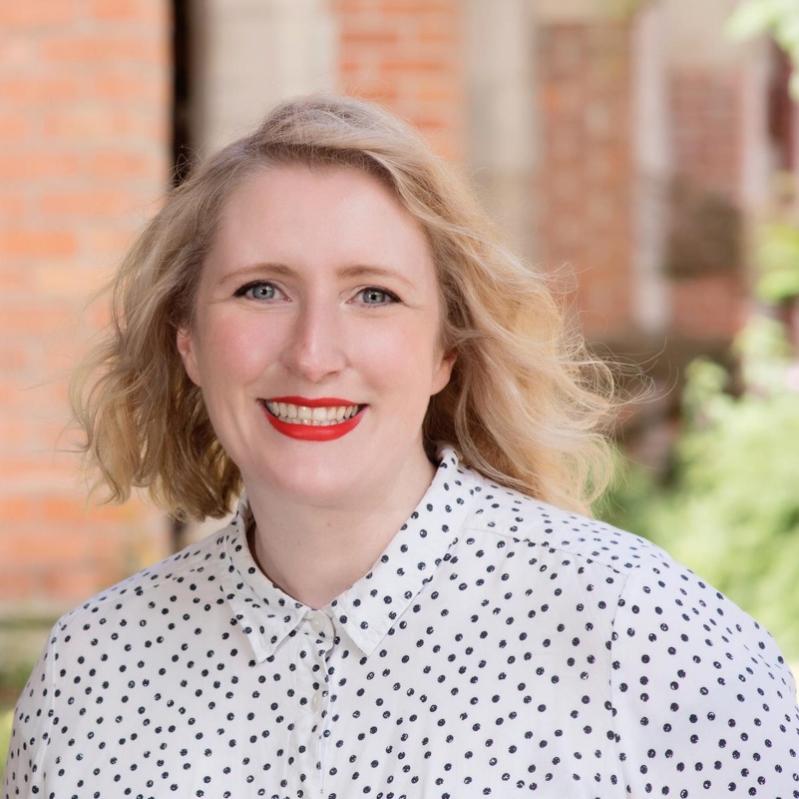 Head and shoulders of Aislinn Clarke smiling