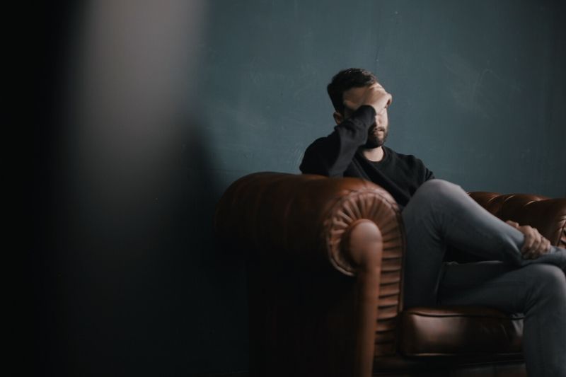 man sitting on a sofa