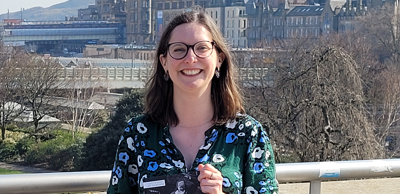 Head and shoulders of Sophie Cooper smiling in the sunshine