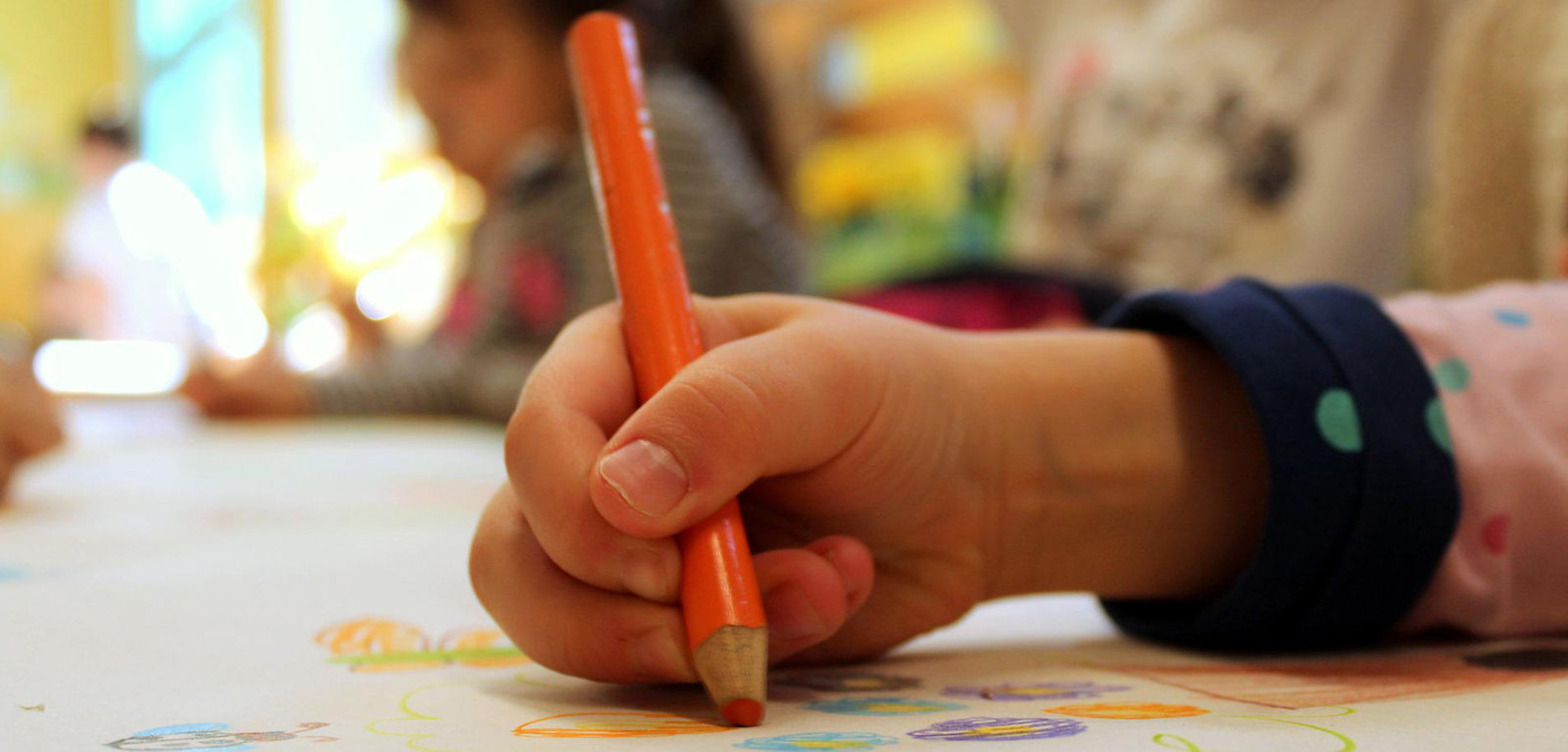 Child holding a crayon